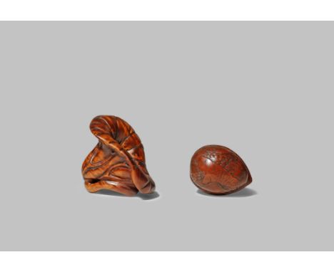 TWO JAPANESE NETSUKE MEIJI 1868-1912 One wood and depicting a stylised lotus flower, the conical bloom growing on a short sta