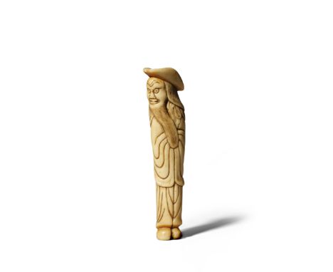 A JAPANESE STAG ANTLER NETSUKE EDO 1603-1868 Depicting a tall foreigner with a large brimmed hat, his hands neatly tucked in 