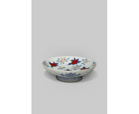 A SMALL JAPANESE NABESHIMA DISH 19TH/20TH CENTURY The well decorated in underglaze blue, red, yellow, and green enamels with 
