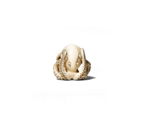 A GOOD JAPANESE IVORY NETSUKE OF AN OCTOPUS EDO/MEIJI PERIOD The mollusk resting with its tentacles curling against its large