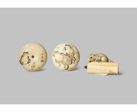 TWO JAPANESE IVORY NETSUKE MEIJI 1868-1912 One a manju, the front depicting three frogs in low relief walking on their hind l