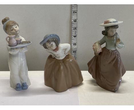 Three Nao figurines 