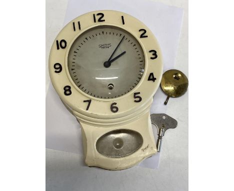 A vintage Smiths Enfield bakelite wall clock with key and pendulum 