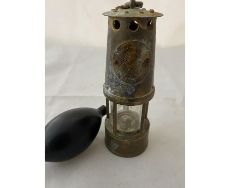 A miniature miners lamp and pressure balloon 