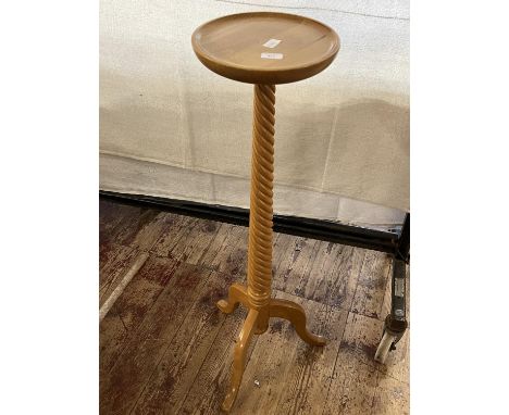 A modern wooden planter stand with barley twist decoration, shipping unavailable 