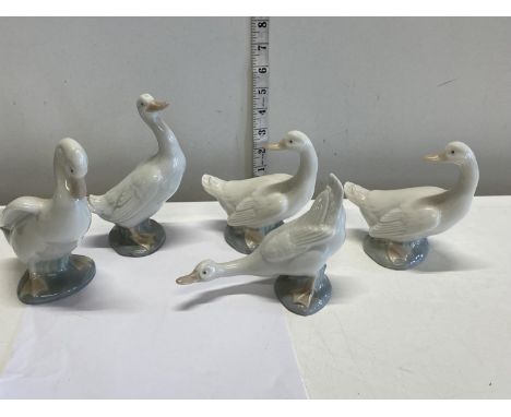 Five Nao goose figurines 