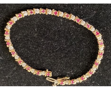 A 9ct gold Ruby and Diamond bracelet. 18.5cm overall length. 