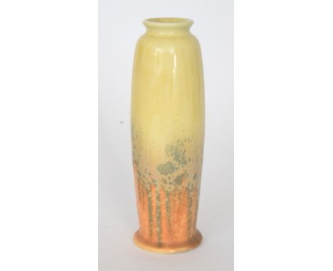 A Ruskin Pottery crystalline vase of rolling pin form decorated in a yellow to orange glaze with blue flecks, impressed mark,