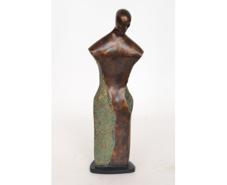 A contemporary resin sculpture of a head and torso by Carolyn Kinder for Austin, in the style of Henry Moore, with a bronzed 