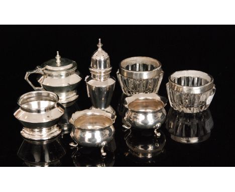 An Art Deco style hallmarked silver three piece cruet, Birmingham 1933, Blakemore Fletcher Ltd, together with a pair of monog