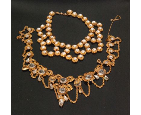 A 1950s Christian Dior style gilt metal festoon necklace formed of fifty four wirework circles
inset with circular brilliant 