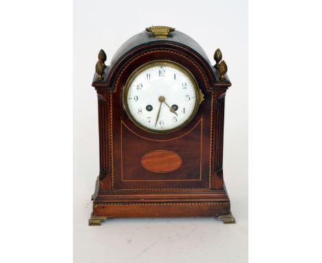 An Edwardian line inlaid and chequer strung bracket clock circular white enamelled dial, eight day striking movement on ogee 