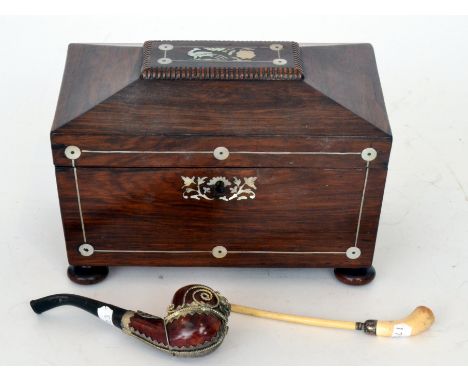 A 19th Century mother of pearl inlaid rosewood tea caddy of sarcophagal form together with a metal mounted briar pipe and a c