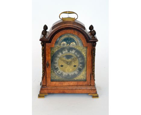 An 18th Century style walnut case bracket clock with silvered chapter ring and engraved Thomas Tom London, pierced brass corn