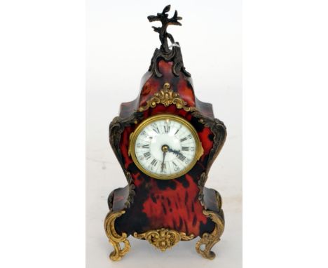 A 20th Century Louis XVI style simulated red tortoiseshell gilt metal mounted mantle clock of cartouche form, height 25cm, S/