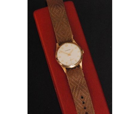 A 1970s 9ct Garrard and Co gentleman's manual wind wrist watch, cream linen dial with gilt Arabic numerals and subsidiary sec