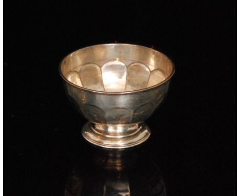 A hallmarked silver bowl, circular stepped base below part panelled sides, diameter 15cm, weight 5.5oz, Sheffield 1909. 