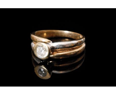 A contemporary 9ct hallmarked single stone diamond ring, collar set brilliant cut stone to a two coloured twist shank, ring s