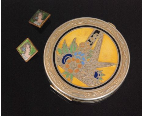 A French Art Deco style Sterling Silver and enamel compact of circular outline, centred by enamelled flowers in blues and gre