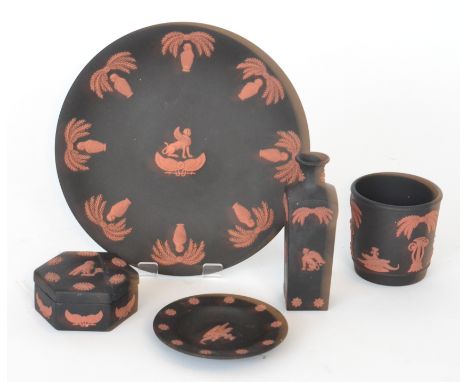 Five pieces of Wedgwood Egyptian Revival jasperware with terracotta low relief motifs against a black basalt ground comprisin