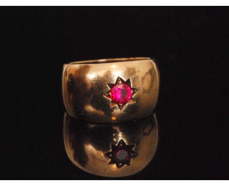A mid 20th Century ring with central single gypsy set ruby to centre, ring size leading edge T 1/2.