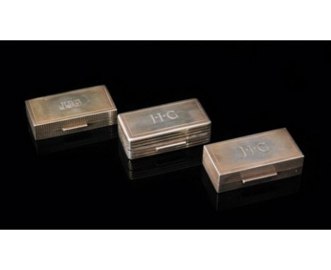 Three modern rectangular hallmarked silver snuff boxes, each with engine turned design, plain rectangular thumb plate and gil