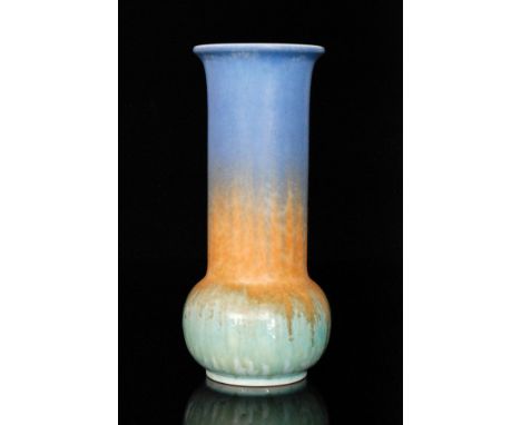 A Ruskin Pottery vase of globe and shaft form decorated with a pale blue to orange to green mottled glaze, impressed mark, da