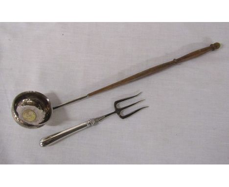 Silver handled toasting fork Sheffield hallmark &amp; a white metal ladle with coin