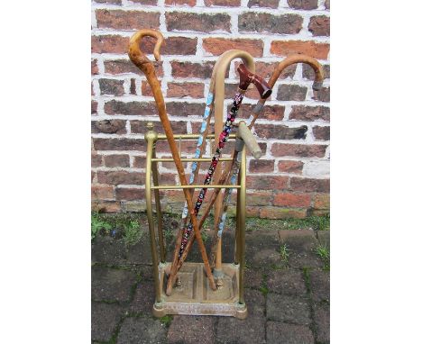 Brass stick stand with assorted walking sticks inc elephant stick