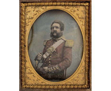 * Ninth-plate daguerreotype of a high-ranking British military officer, c.1855, half-length and seated, hand-coloured red tun