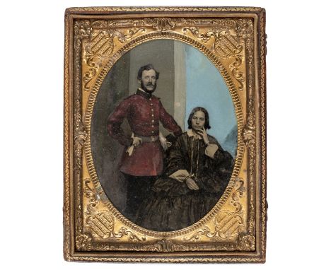 * Half-plate ambrotype of a British officer (possibly Royal Engineers) and his wife, c.1860, three-quarter length, the office