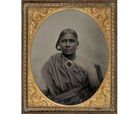 * Ethnographic Portrait. A sixth-plate ambrotype of a Sinhalese or Indian woman, c. 1860s, half-length facing camera, gilt no