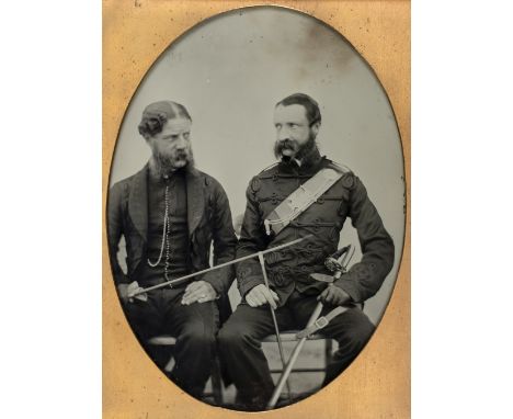 * Quarter-plate ambrotype of a Rifle Brigade officer and his civilian (?)brother, c.1860, three-quarter length and seated, li