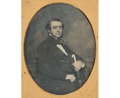 * Cased Images. A group of 3 quarter-plate daguerreotypes, c. 1850s, one of a middle-aged seated man with umbrella in a photo