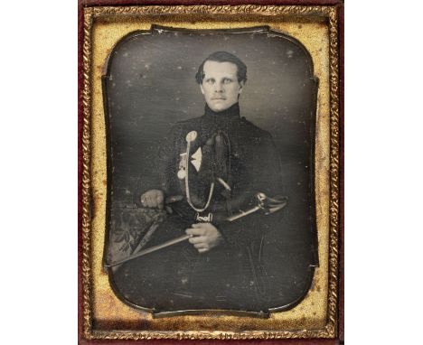 * Quarter-plate daguerreotype of a British officer, possibly Rifle Brigade, late 1840s, three-quarter length and seated, his 