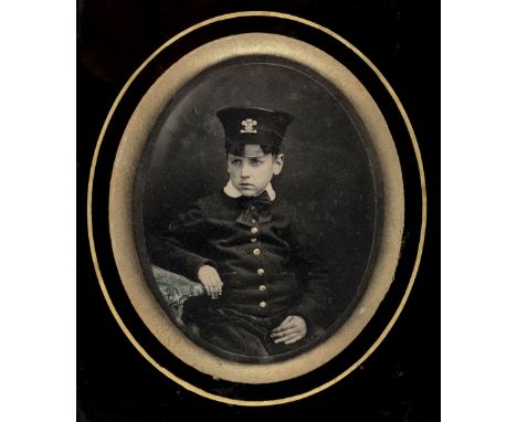 * Quarter-plate ambrotype of a young boy (army cadet?) in uniform with Prince of Wales plume badge, late 1850s, three-quarter