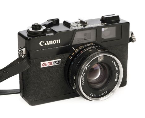 * Canon Canonet QL17 G-III. Canon Canonet QL17 G-III 35mm film camera with fixed 40mm f/1.7 lens, scarce fully black body, le