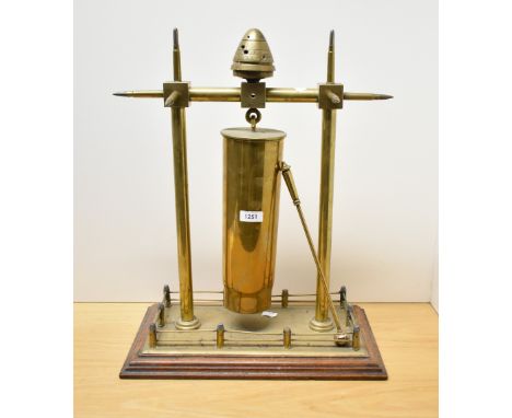 An impressive World War 1 Trench Art dinner gong, constructed using spent bullet casings, brass rails and surmounted with a t