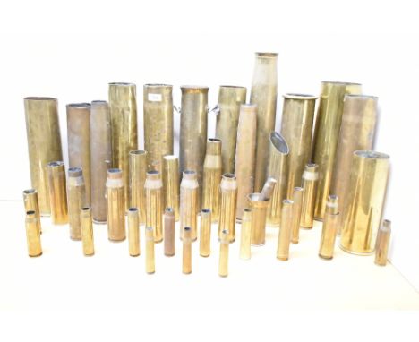 A collection of World War I &amp; II brass artillery shell and ammunition casings, various French 75DEC, German Patronenfabri