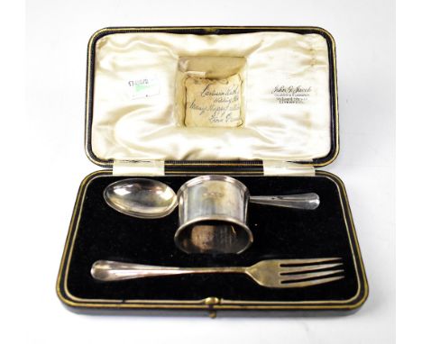 A cased George V hallmarked silver Christening set, comprising spoon, fork and napkin ring. Sheffield 1925, approx 2.9ozt.