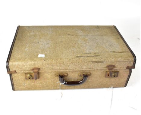 A vintage brown suitcase containing a quantity of Bayko building blocks for a two house, two vintage biscuit tins containing 