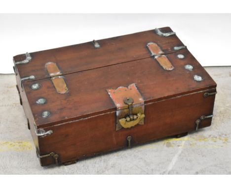 A Korean elm brass bound coin chest with ornate fish padlock and strapwork hinges, with further roundel decorations, 23.5 x 6