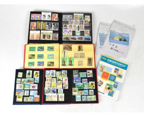 Two 'The Stamp Collector's Stock Book' albums, each containing a number of 20th century Japanese stamps and first day covers,