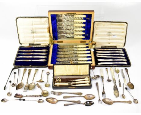 A cased set of six butter knives with hallmarked silver handles, a cased set of five butter knives with hallmarked silver han
