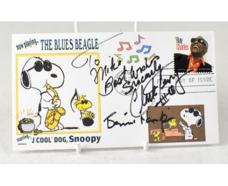 SNOOPY, THE BLUES BEAGLE; a first day cover bearing two signatures including Clark Terry.We have not authenticated these sign