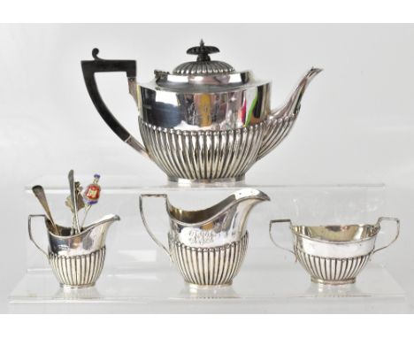 An Edwardian hallmarked silver three-piece tea set of boat-shaped form and demi-gadrooned, each piece initialled 'JIT', compr