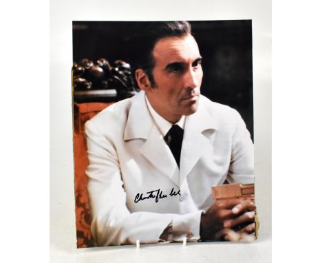 CHRISTOPHER LEE; a coloured photograph of the acting star, bearing his signature, 25 x 20cm.We have not authenticated this si