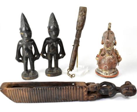 A small mixed lot of carved African figures, to include a pair of female figures, a terracotta seated female, a further carve