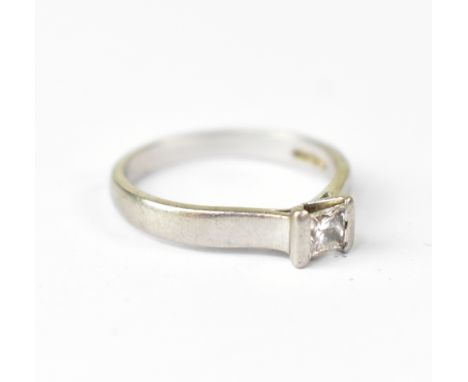 A bespoke made platinum solitaire ring with central tension set princess cut diamond, the IGI certificate states the diamond 