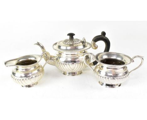 A three-piece Middle Eastern/Continental silver bachelor's tea set (possibly 800 or 830 grade), comprising a bachelor teapot,